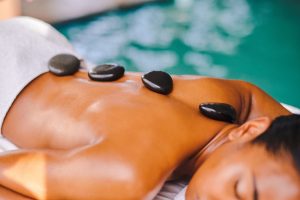 Hot stone Massage therapeutically stressed muscles thermal sensations
